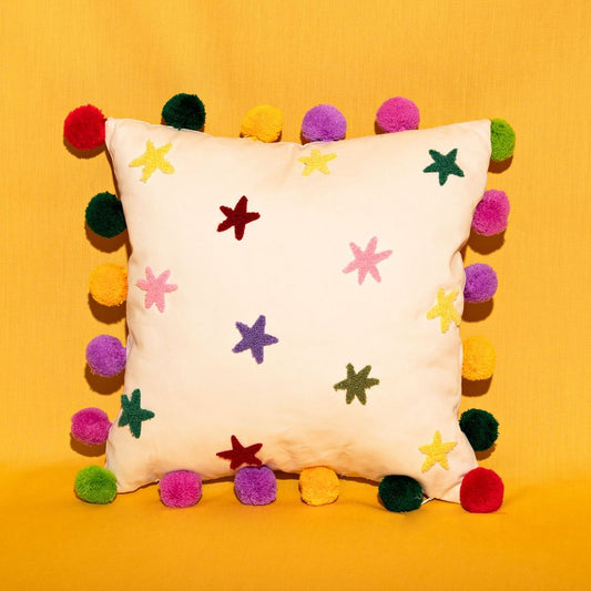 RASPBERRY BLOSSOM TUFTED STARS CUSHION WITH POM POMS