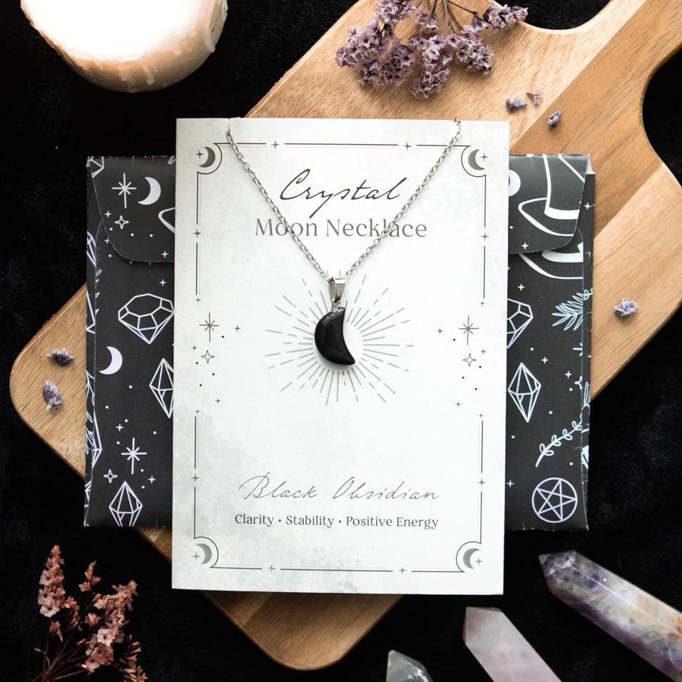 BLACK OBSIDIAN CRYSTAL MOON NECKLACE ON GREETING CARD