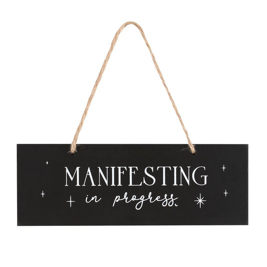 MANIFESTING IN PROGRESS HANGING SIGN